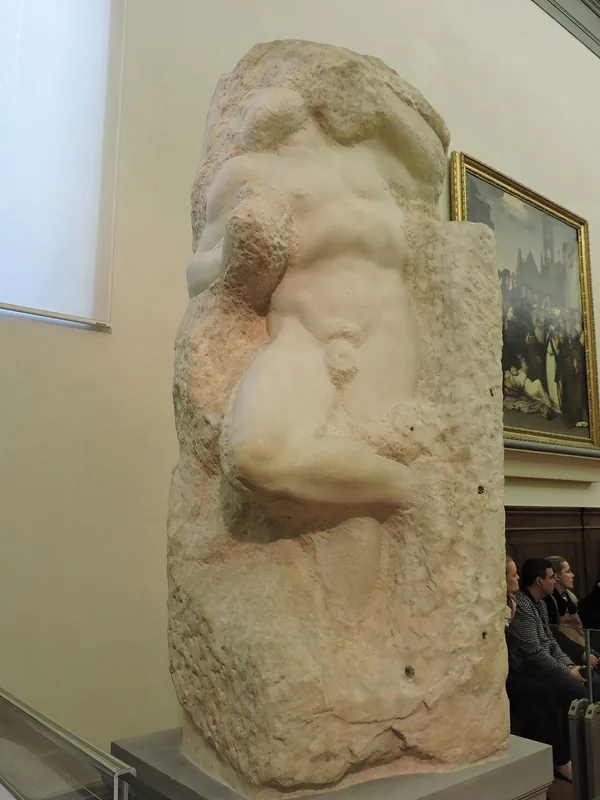 Michelangelo's unfinished marble Awakening Slave, Galleria dell'Accademia, Florence